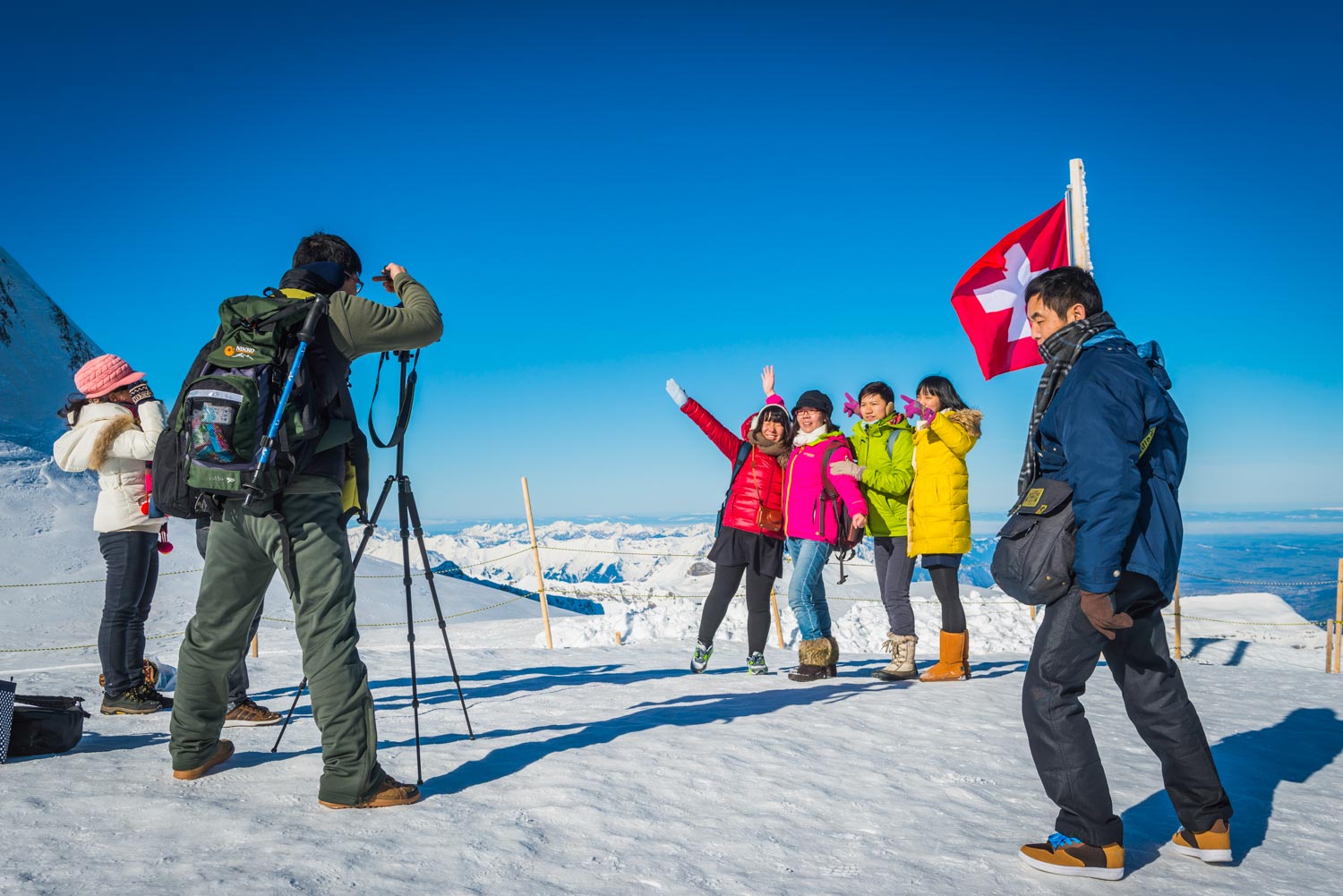 Japanese tourists enjoying winter snow in Alps Switzerland